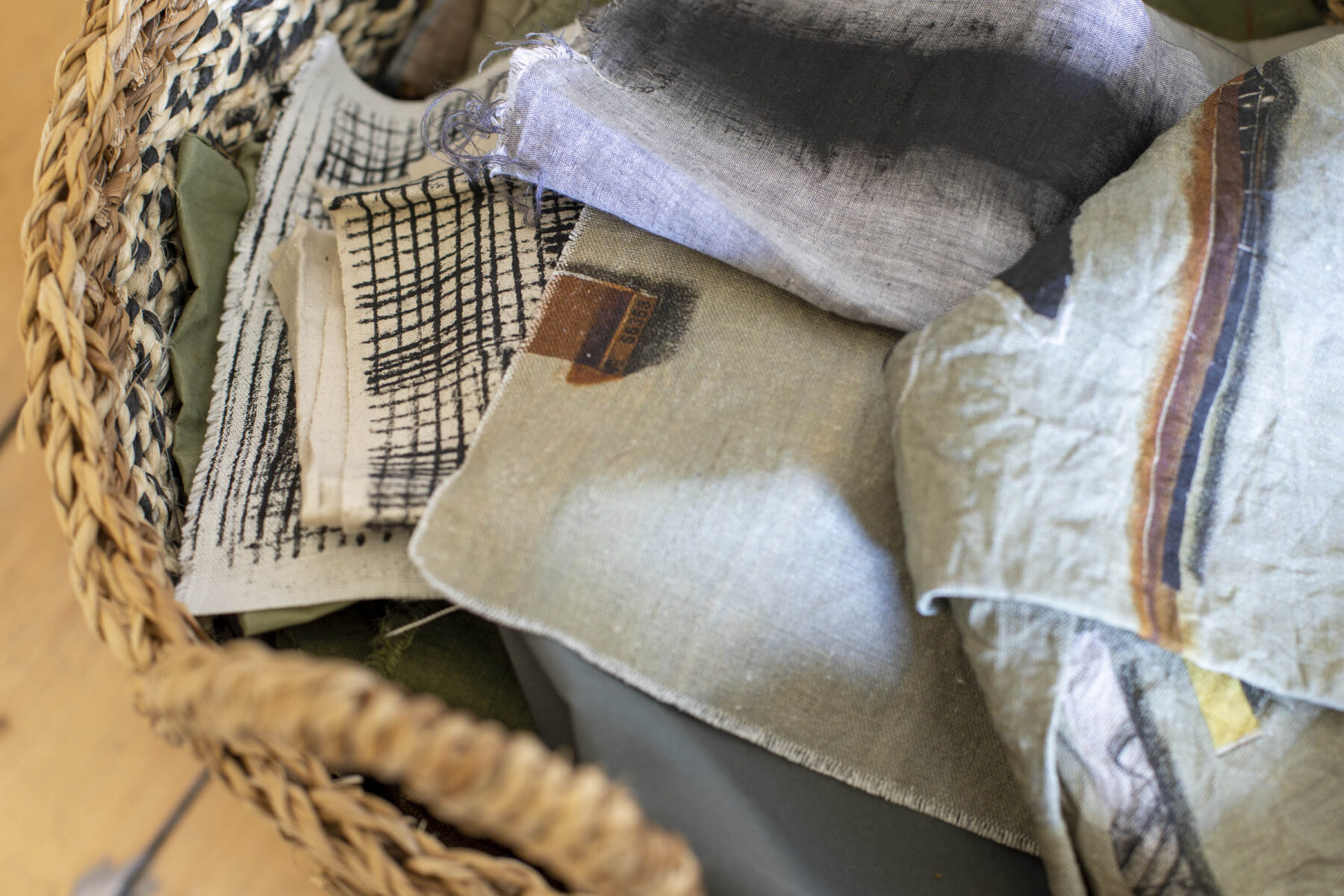 Basket of hand and digitally printed textiles on linen by Gail Turpin.
