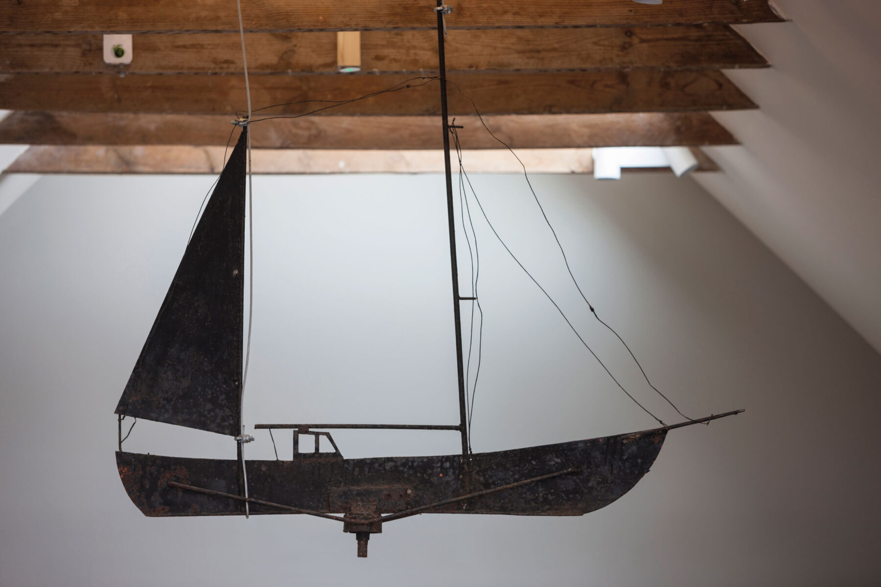 Boat weather vane hanging from ceiling at Kylesku Hotel, Scotland.