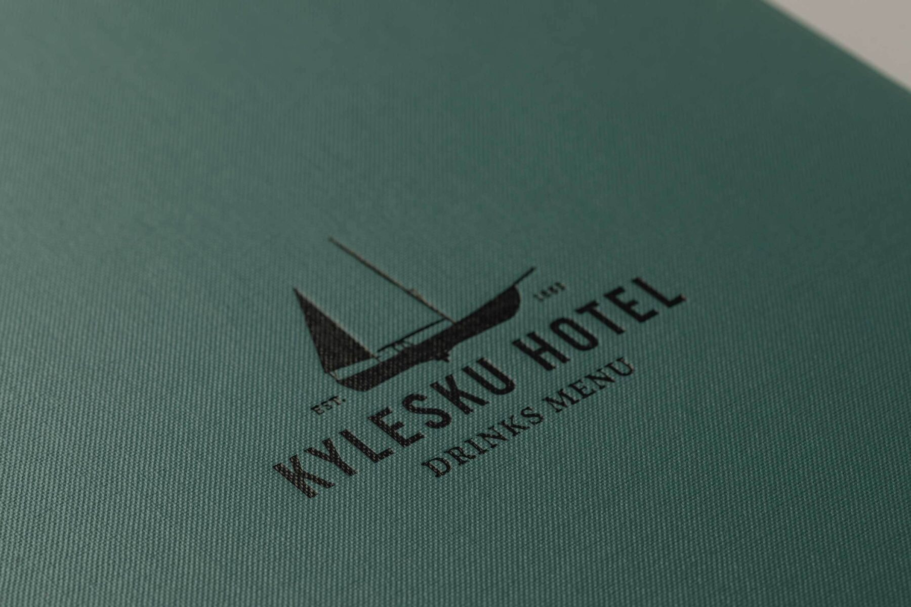 Close-up of blue drinks menu for Kylesku Hotel, Scotland.