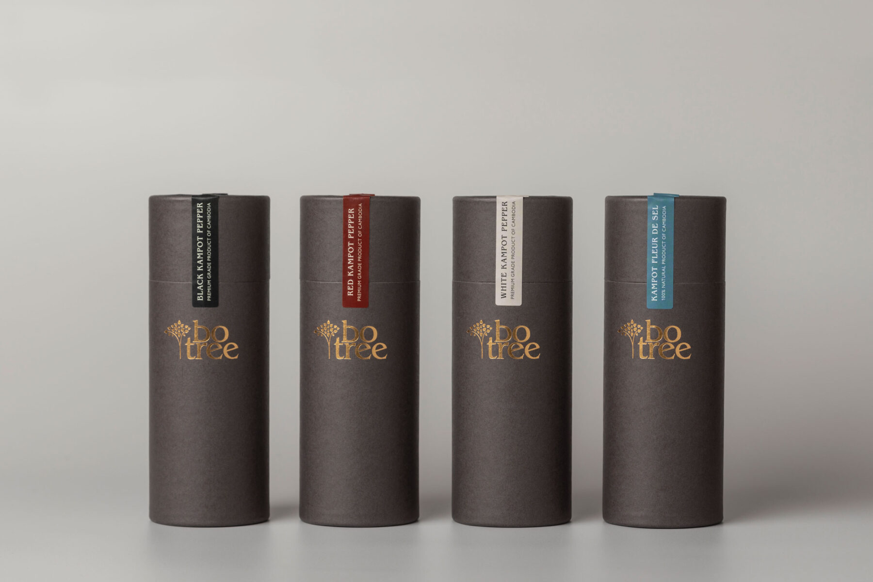 4 brown card tubes with colour-coded stickers for Botree seasonings.