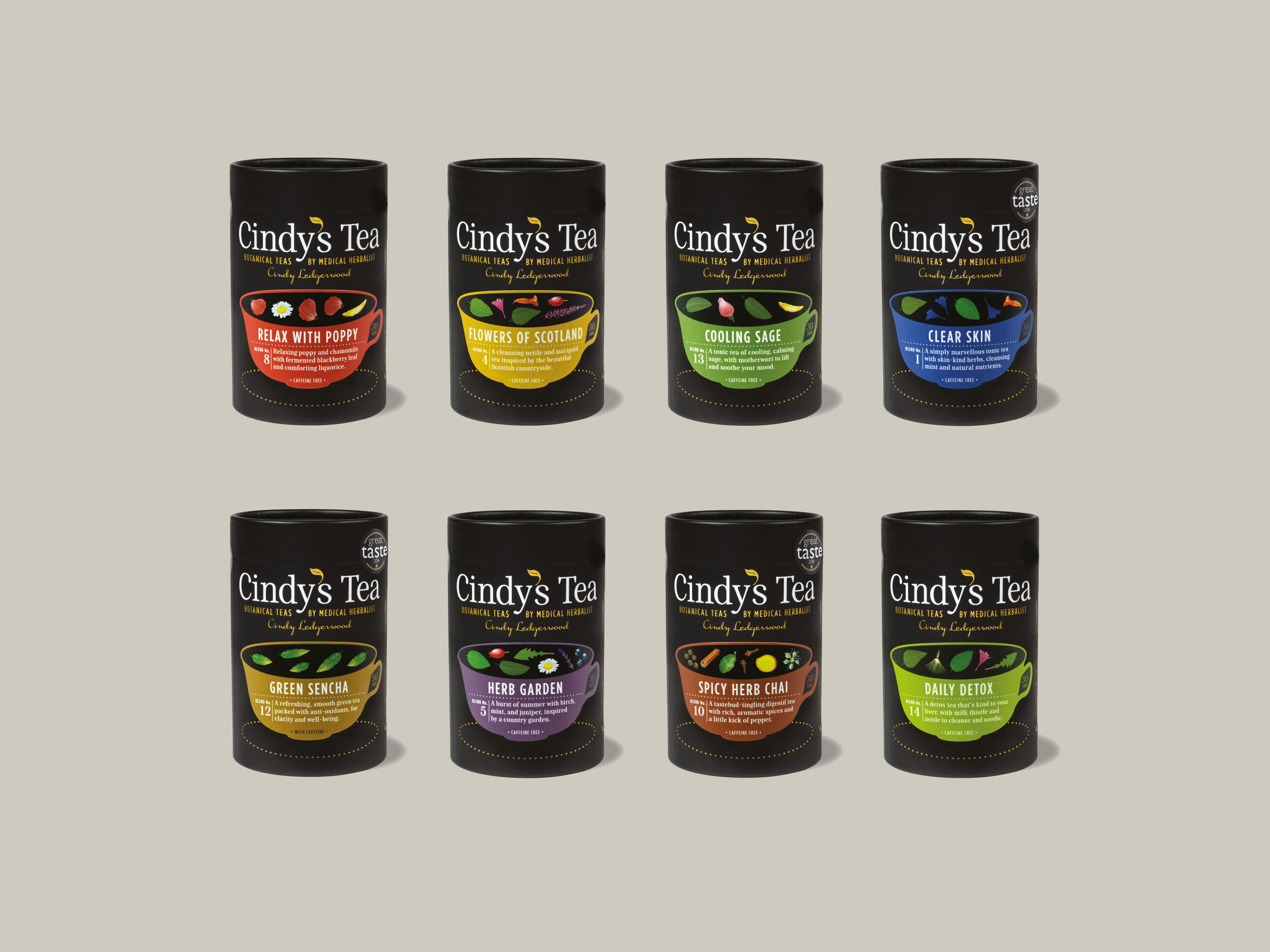 8 black cardboard Cindy's Tea caddys with varient teacup stickers in bright colours.